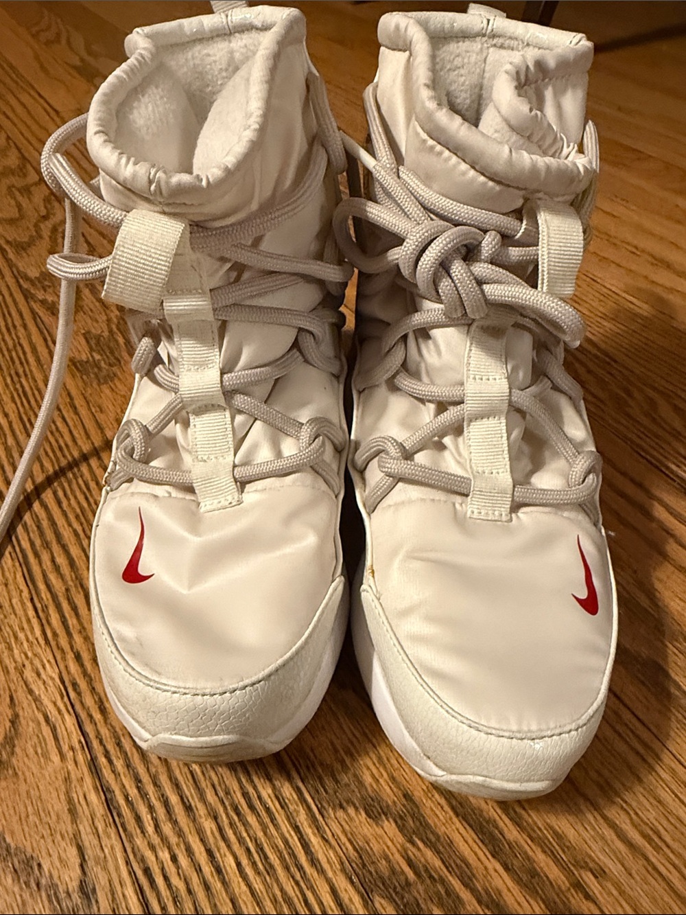 Nike White High-Top Sneakers with Red Swoosh